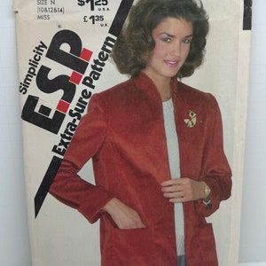 May include: Simplicity pattern number 5270, Extra-Sure Pattern, for a red corduroy jacket with a zip closure and pockets. The pattern is for sizes 10, 12, and 14.