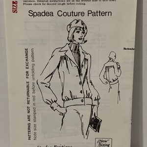 May include: A black and white illustration of a sewing pattern for a jacket. The pattern is labeled "Spadea Couture Pattern" and "Spadea Boutique". The pattern number is 72853.