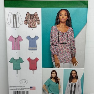 May include: Simplicity sewing pattern number 1162 H5 for women's tops. The pattern includes six different styles of tops with various necklines, sleeve lengths, and embellishments. The pattern is designed for sizes UK 6-14, TALLA EURO 32-40, TAILLE FR 34-42.
