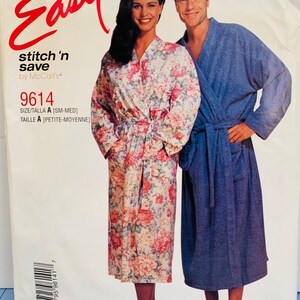 May include: A sewing pattern for a robe, with a floral print for women and a solid blue print for men. The pattern is called "Easy Stitch 'n Save" by McCall's and the pattern number is 9614. The pattern is for sizes small to medium.