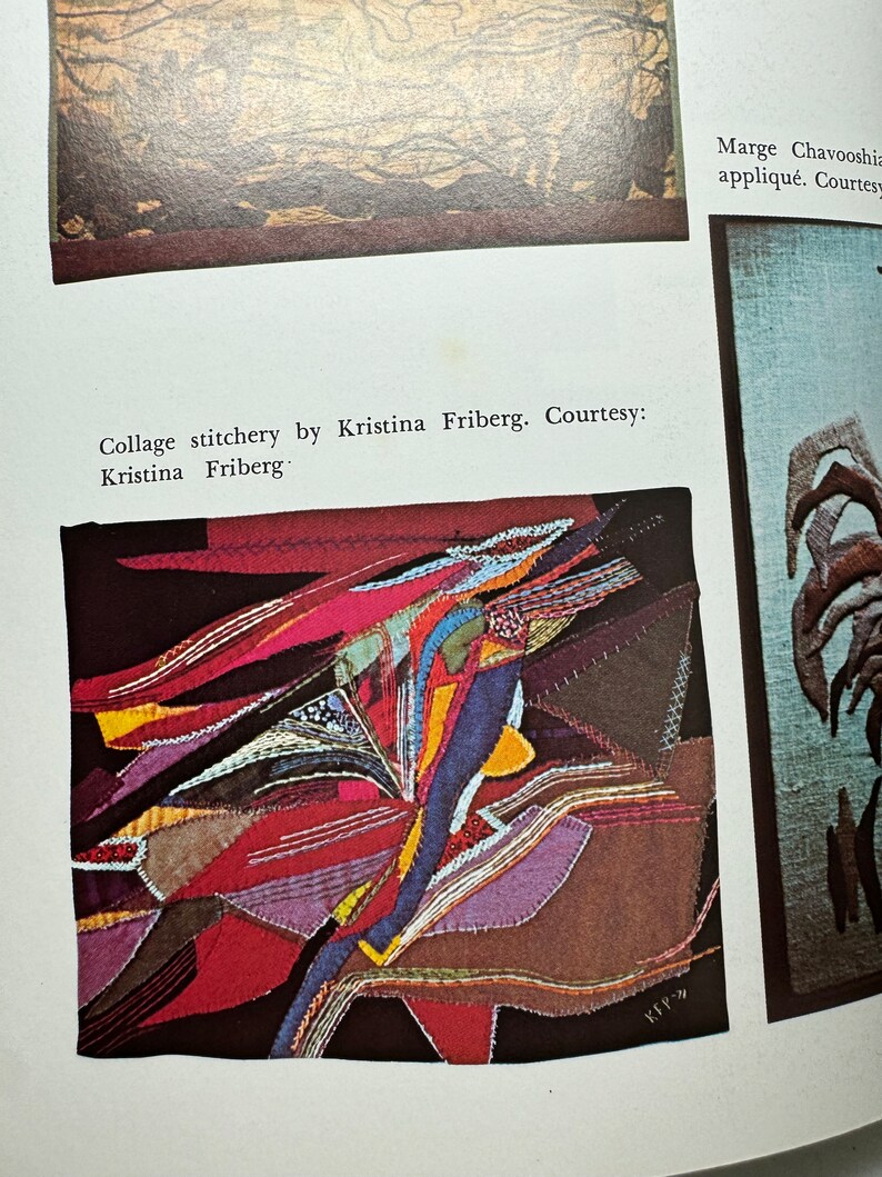 May include: A colorful abstract collage made of fabric scraps sewn together. The fabric is in shades of red, orange, yellow, blue, purple, and brown. The collage is framed with a black border.