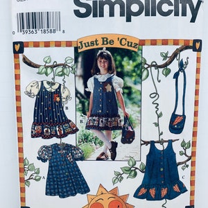 May include: Simplicity sewing pattern number 7015, "Just Be 'Cuz", for sizes 3, 4, 5, and 6. The pattern includes instructions for making three different dresses: a dress with short sleeves and a Peter Pan collar, a sleeveless dress with a gathered skirt, and a sleeveless dress with a heart-shaped skirt.