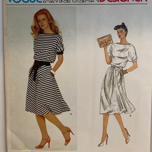 May include: A vintage sewing pattern for a dress with a striped and a solid white version. The pattern is from Vogue American Designer, Bill Haire for Friedricks Sport, and the pattern number is 2434.