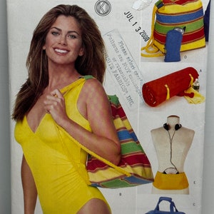 May include: A sewing pattern for a swimsuit, a tote bag, a beach towel, and a travel bag. The pattern is from Butterick and designed by Kathy Ireland. The pattern number is 6621 and the date is July 13, 2000.