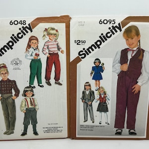 May include: Two Simplicity sewing pattern envelopes for children's clothing. The pattern on the left is number 6048 and the pattern on the right is number 6095. Both patterns are priced at $2.50.