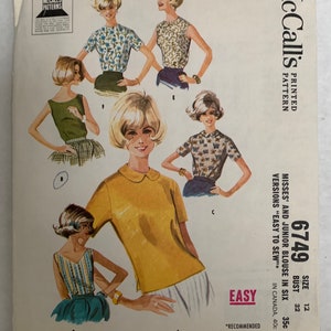 May include: Vintage McCall's sewing pattern for misses' and junior blouses. The pattern features illustrations of six blouse variations. The pattern number is 6749, size 12, bust 81 cm. The pattern is marked "Easy to Sew."