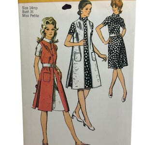 May include: Vintage Simplicity sewing pattern, number 9269, featuring illustrations of three women in dresses and coats. The pattern includes sizes for a bust of 36 inches and is for Miss Petite. The cover is white with black and orange text.