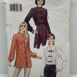 May include: A sewing pattern for three different blouses. The pattern is for sizes 8-10-12. The pattern is called "Very Easy Very Vogue" and the pattern number is 9163.