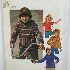 May include: Simplicity sewing pattern number 8121 for boys and girls size 12. The pattern includes three different hooded sweatshirts. One is striped, one is floral, and one is solid blue. The pattern also includes a red polo shirt.