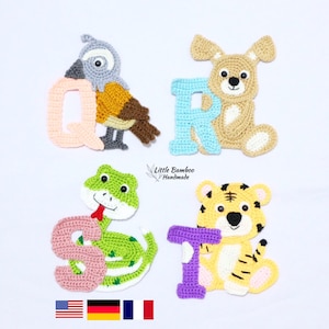 May include: Four handmade crochet appliques featuring animals and letters. A grey and brown bird with the letter Q, a tan dog with the letter R, a green snake with the letter S, and a yellow tiger with the letter T. Text reads Little Bamboo Handmade.