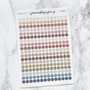 May include: A sheet of 4mm dot stickers with a variety of colours, including beige, brown, green, blue, and grey. The sheet is labelled "4MM DOTS BY jemdesigns C166".