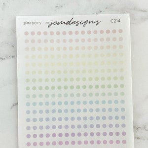 May include: A sheet of 2mm pastel rainbow dot stickers with the text "2MM DOTS BY jenn designs C214".