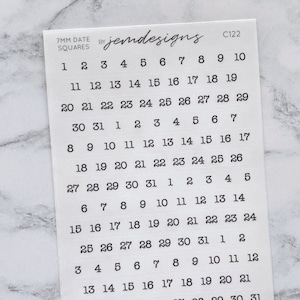 May include: A white sheet of paper with black numbers printed on it. The numbers are arranged in a grid pattern, with each row containing the numbers 1 through 31. The numbers are used for a date stamp.
