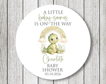 Pegatinas para baby shower con la frase "Un pequeño bebé-saurio está en camino"