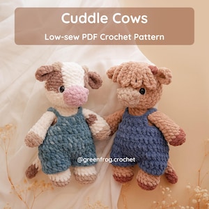May include: Two plush crochet cow toys, one white and brown and one light brown, both wearing blue overalls. The image features the text Cuddle Cows Low-sew PDF Crochet Pattern and the handle @greenfrog.crochet in white text on a brown background.