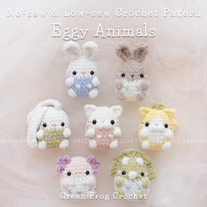 May include: A set of seven crocheted egg-shaped animal amigurumi toys. The toys are in various colors, including pink, blue, yellow, and green. The toys are all sitting on a pink background. The text "No-sew & Low-sew Crochet Pattern Eggy Animals" is at the top of the image. The text "Green Frog Crochet" is at the bottom of the image.