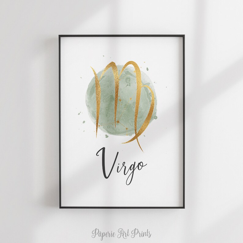 May include: A watercolor print of the Virgo zodiac sign in gold with a green background. The word "Virgo" is written in black cursive below the sign.