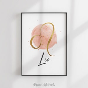 May include: A pink watercolor circle with gold glitter and a gold outline of the Leo constellation. The word "Leo" is written in black cursive below the circle.