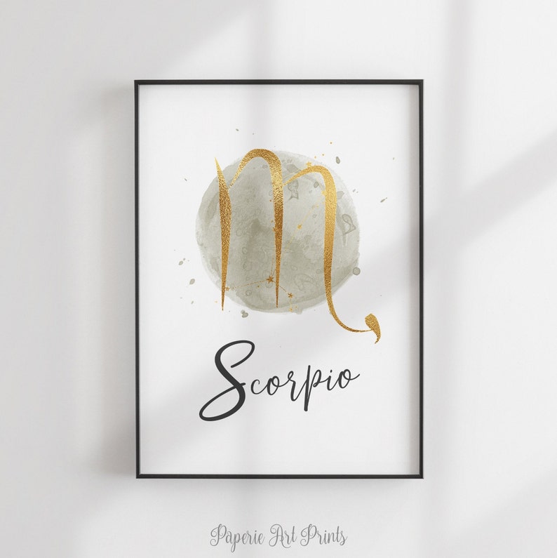 May include: A gold Scorpio zodiac sign on a gray watercolor background with the word "Scorpio" written in black cursive.