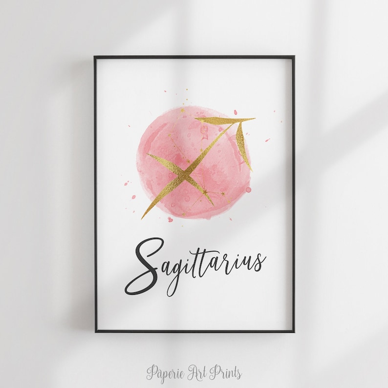 May include: Pink watercolor illustration of the Sagittarius zodiac sign with gold glitter and a gold arrow. The text "Sagittarius" is written in black cursive below the illustration.