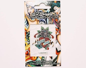 May include: Ed Hardy by Christian Audigier ICING brand peel and stick crystal decal featuring a red heart with a green flower and the words "Eternal Love" in blue and white.