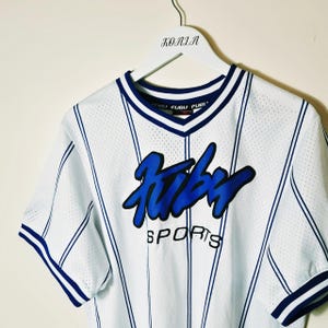 Vintage Y2K 90s 2000s Rare Blue and White Pullover Striped Fubu Jersey. Fubu Sports Jersey Top