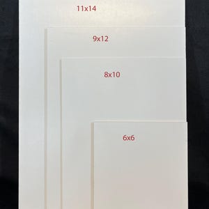 May include: Four white square canvases of different sizes, with the dimensions written in red on each canvas. The canvases are arranged in a decreasing size order from left to right, with the largest canvas measuring 11x14 inches, followed by 9x12 inches, 8x10 inches, and the smallest canvas measuring 6x6 inches.