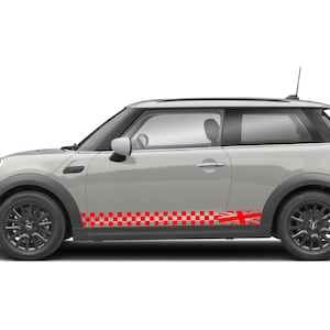 May include: A silver Mini Cooper with a red checkered and Union Jack stripe decal on the side.