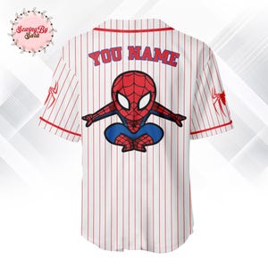 A white baseball jersey with a red and blue Spiderman design on the back.