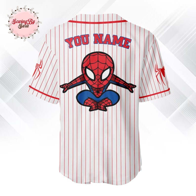 A white baseball jersey with a red and blue Spiderman design on the back.
