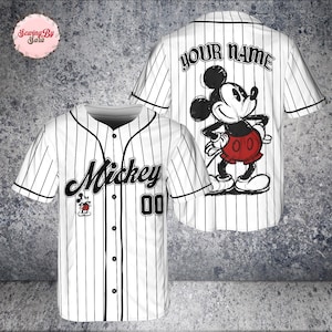A white baseball jersey with a Mickey Mouse design and the text "Your Name" printed on the back.