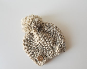 Knitted Knit Baby Beanie Hat with Coconut Button Embellishment and Pom Pom. Handmade in Chunky, Wool Yarn.