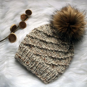 BeaCapes Design Belva Beanie. Knitted Spiral Knit Beanie Hat with Handmade Faux Fur Pom Pom. Handmade in Chunky Yarn.