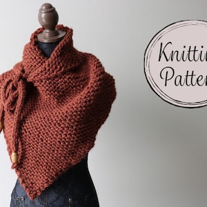 May include: A rust-colored knitted shawl with wooden beads on the ties. The shawl is draped over a mannequin and the text "Knitting Pattern" is visible in a circle on the right side of the image.