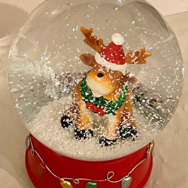 Musical Snow globe, glass water globe, Festive Reindeer on a  Red ornate base! Shake for a beautiful snowfall! Perfect keepsake gift!