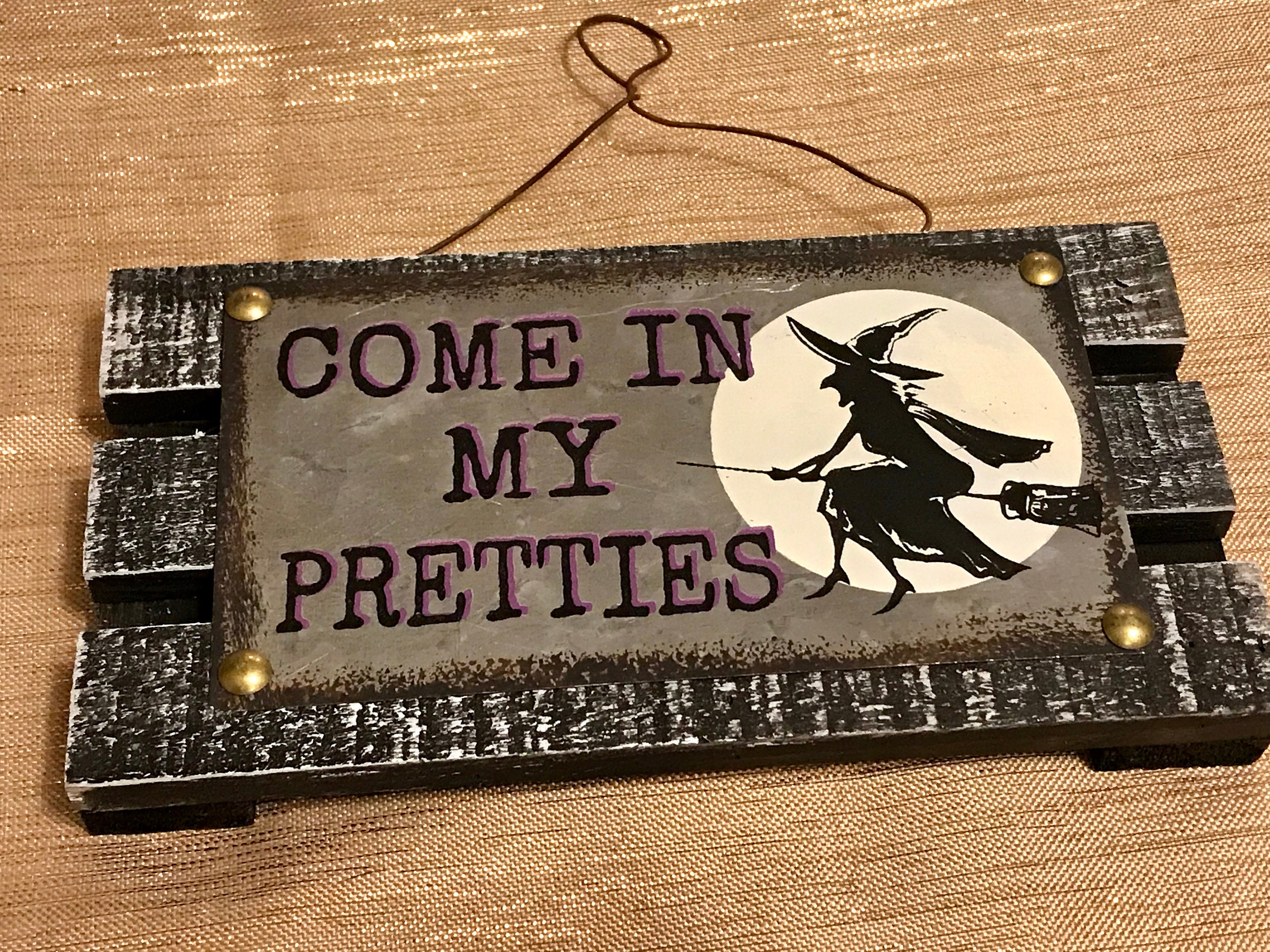 Halloween Metal Signs
 Hanging halloween sign silver metal plaque featuring a witch