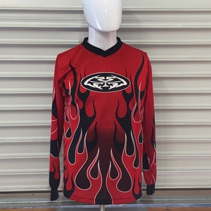 Percy's Vintage & Collectables - 🔥CALGARY FLAMES🔥 The symmetry of this  vintage Calgary Flames jersey are absolutely nuts! It's got a huge  embroidered Flames logo on the front too. This and a