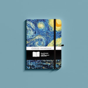 May include: A blue and yellow notebook with a starry night design. The notebook is a dot grid journal with a black elastic closure and a black and white label that reads "Corderoma Dot Grid Journal". The label also says "Dotted Notebook 80gsm woodfree paper imported from Japan".