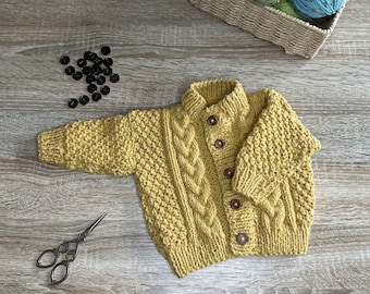 Baby aran cardigan, choice of colour and size.