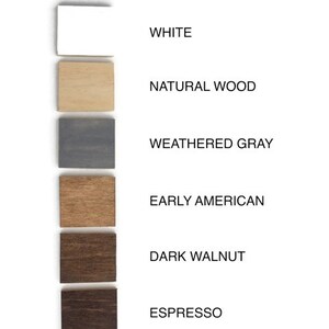 May include: Six wood samples in different colors: white, natural wood, weathered gray, early American, dark walnut, and espresso.