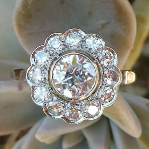 Reserved for J - 1/6 - Art Deco daisy ring in 0.70ct old mine cut diamond and platinum, circa 1910-30, France