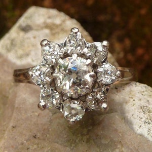 Antique daisy diamond ring with a 0.40ct old mine cut diamond , platinum and 18k white gold, circa 1950-1960, France