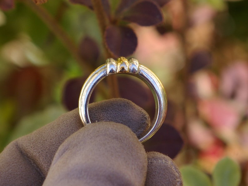 Two-tone sterling silver ring enhanced with yellow gold