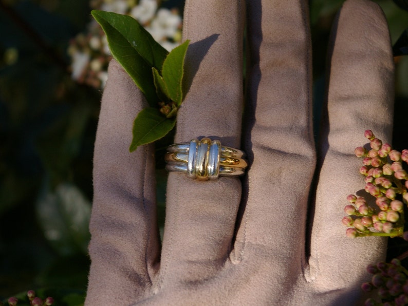 Two-tone sterling silver ring enhanced with yellow gold