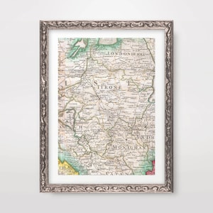 Pode incluir: Um mapa antigo da Irlanda, impresso em preto e branco com detalhes coloridos à mão. O mapa mostra os condados de Tyrone, Monaghan, Cavan e Londonderry. O mapa está emoldurado em uma moldura prateada.