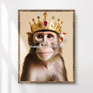 May include: A monkey wearing a gold crown with red and green jewels. The monkey has a serious expression and is looking directly at the camera. The background is a light beige color.