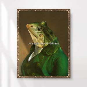 May include: A portrait of a frog wearing a green jacket and white shirt. The frog is looking up and to the right. The background is a dark brown colour. The text "Available from MrArtPrints" is at the bottom of the image.