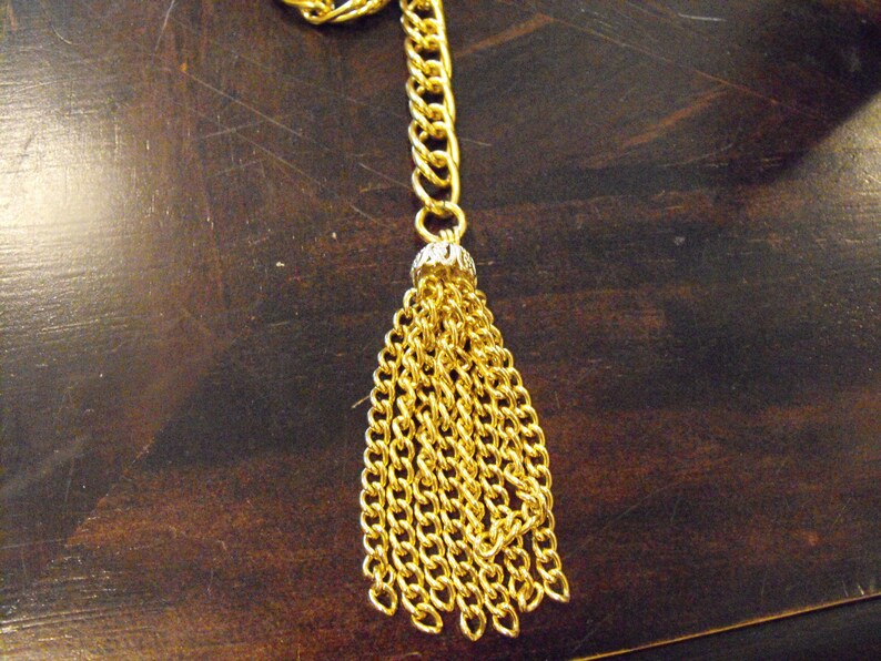 Gold Chain with Decorative Tassel Piece at the Bottom Adjustable in Length Fish Hook Clasp