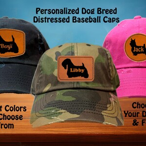 May include: Distressed baseball caps in black, camouflage, and pink, each featuring a personalized dog breed silhouette on a leather patch. The image includes text that reads "Personalized Dog Breed Distressed Baseball Caps", "8 Hat Colors To Choose From", and "Choose Your Design & Font".