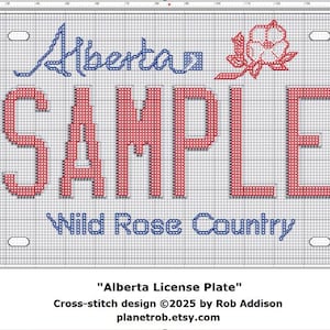 May include: Cross-stitch design of an Alberta license plate with the word "SAMPLE" in red, the word "Alberta" in blue, and the phrase "Wild Rose Country" in blue. A red and white rose is in the upper right corner.